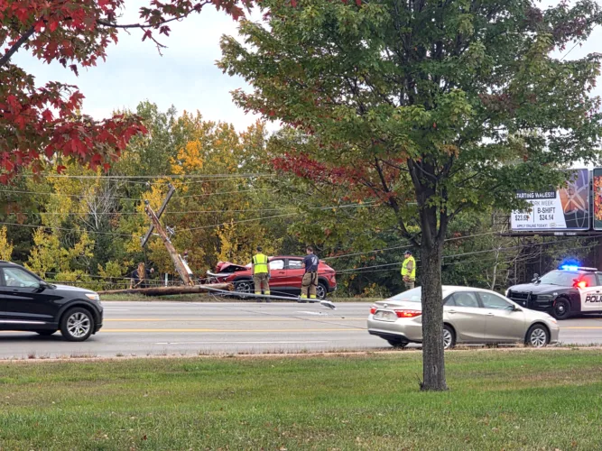 Vehicle hits power pole on US 2